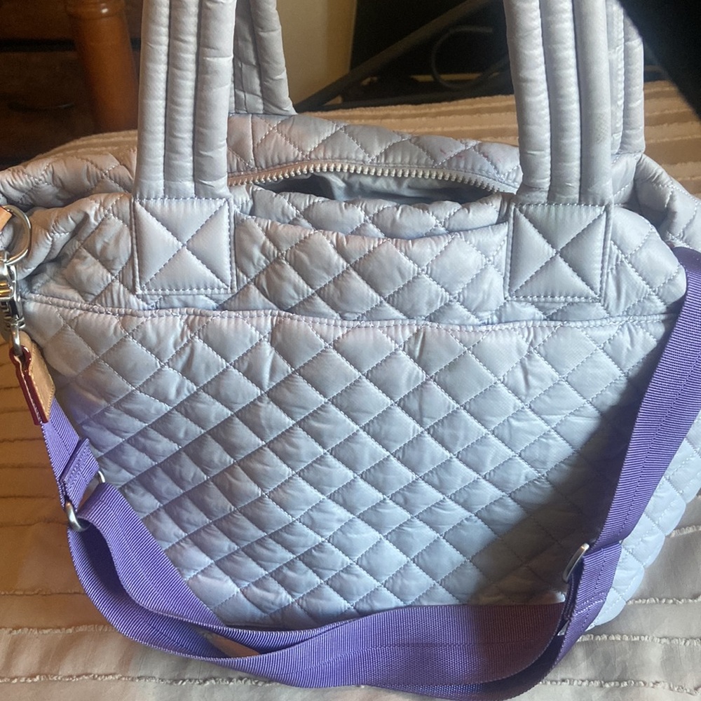 Used MZ Wallace Medium Metro Tote Deluxe in lilac.Stain on interior pocket